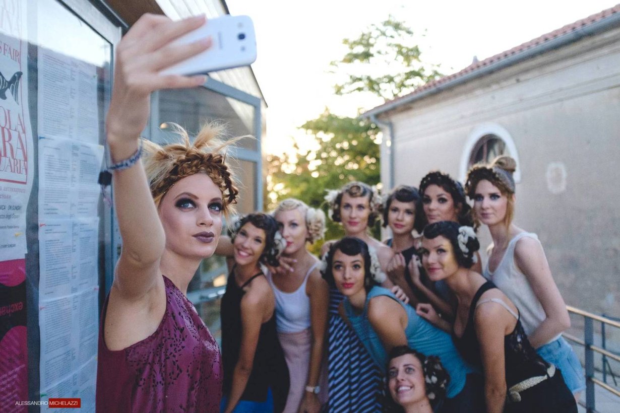Models taking a selfie