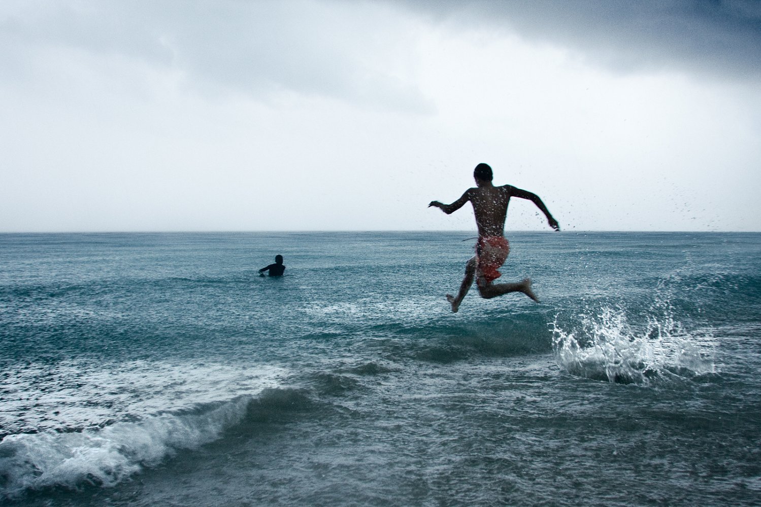 Under a  Caribbean storm, two kids just enojoyed the moment.Digital photo | Canon File |