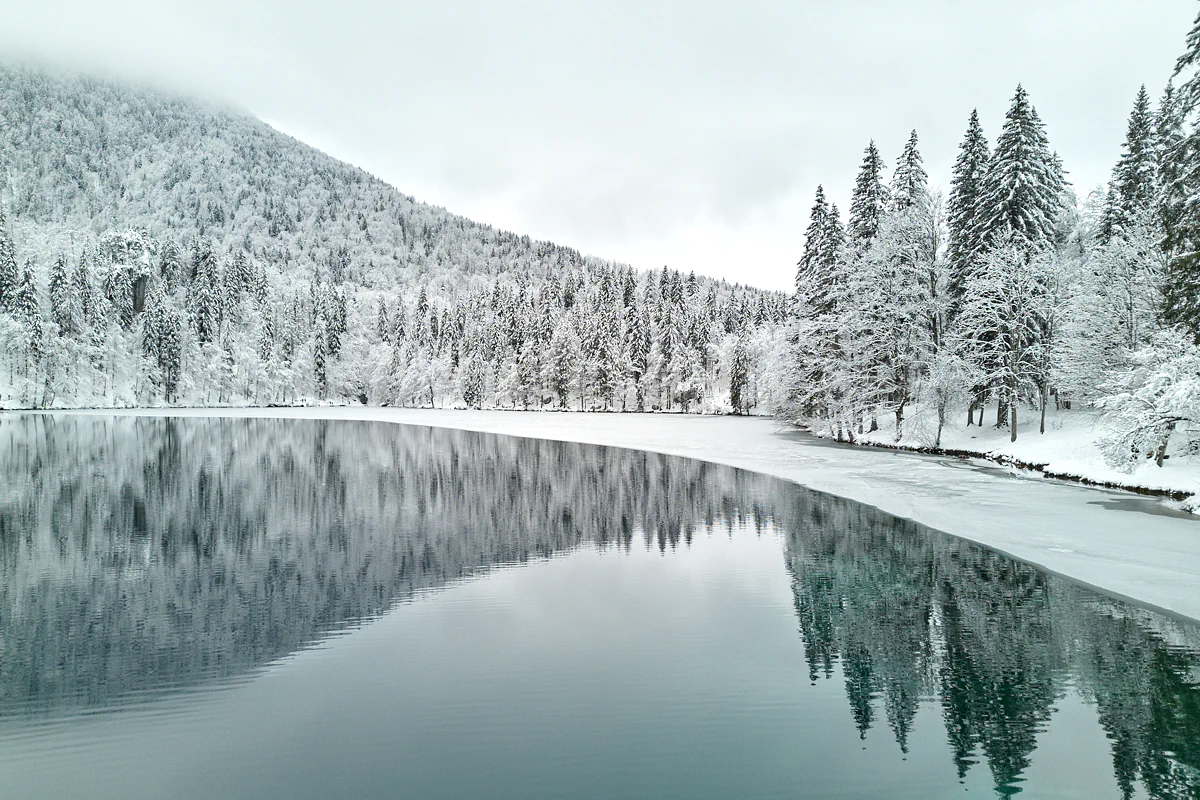Frozen: winter snowy photos shot at the beautiful location of Fusine Lakes in the Friuli Venezia Giulia Italian region